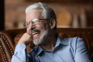 Laughing older man with dentures